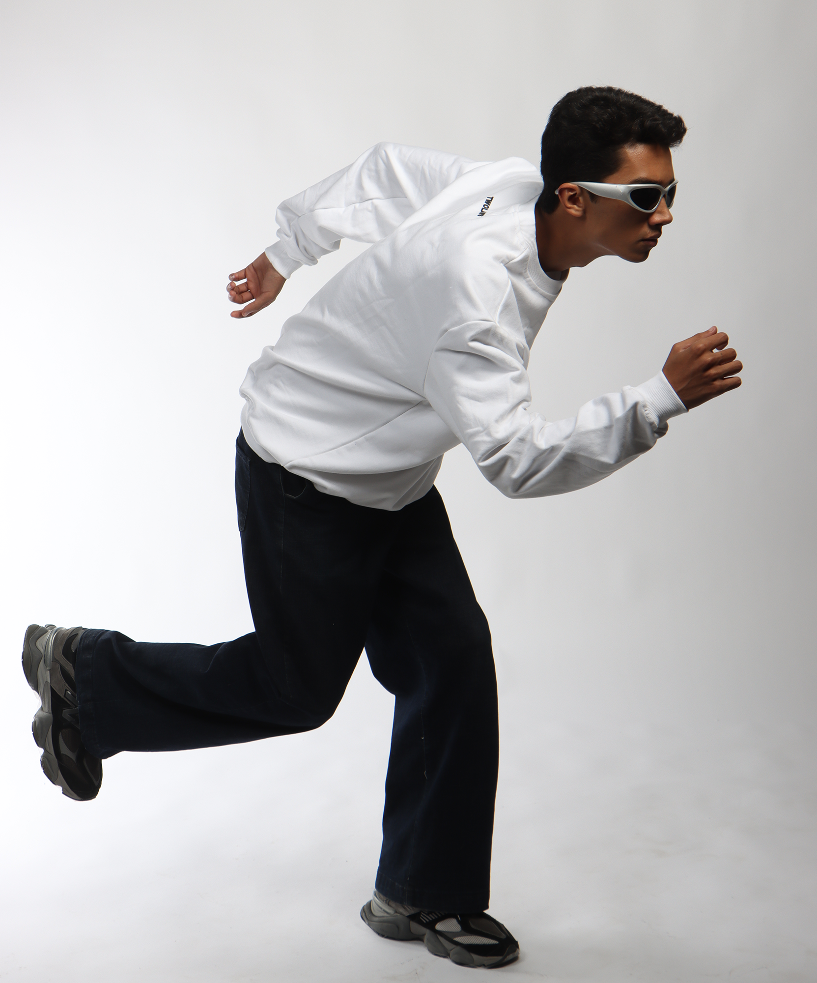 Model wearing TWOLAWS White Faith & Patience Sweatshirt with bold front print and oversized fit.